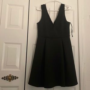 Black dress in excellent terms. It is beautiful and fits nice with a nice V-neck